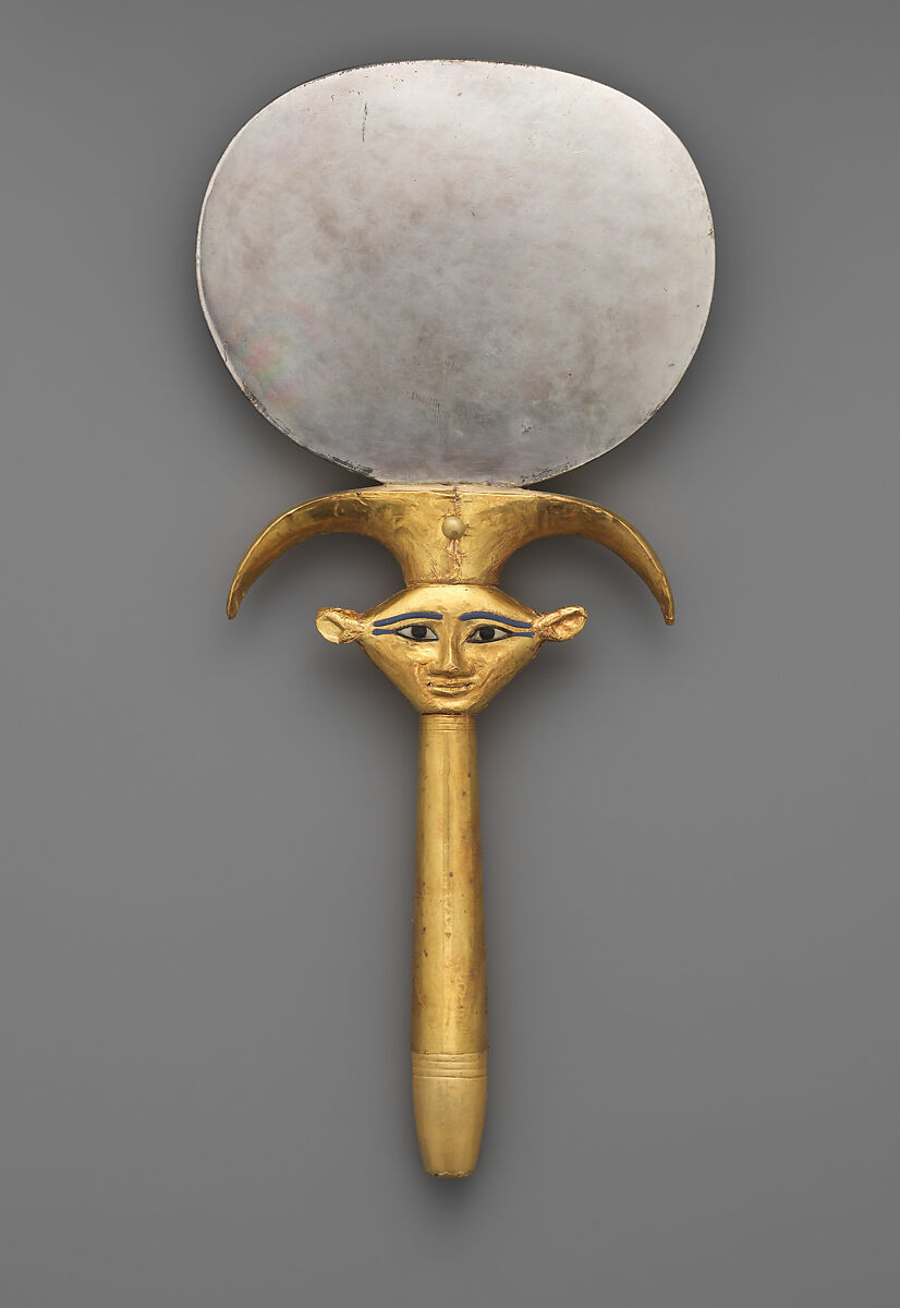 Mirror with a papyrus-shaped handle displaying a Bat-like face, Silver disk with a wood (modern) handle sheathed in gold; the inlays are modern